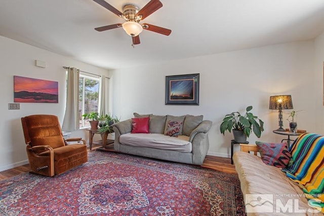 3920 W 7th St, Reno, NV 89503 - living area featuring a ceiling fan, wood finished floors, and baseboards
