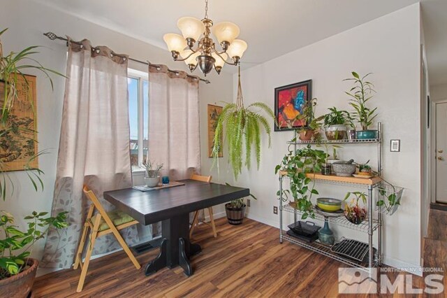3920 W 7th St, Reno, NV 89503 - dining space with a chandelier, wood finished floors, and baseboards