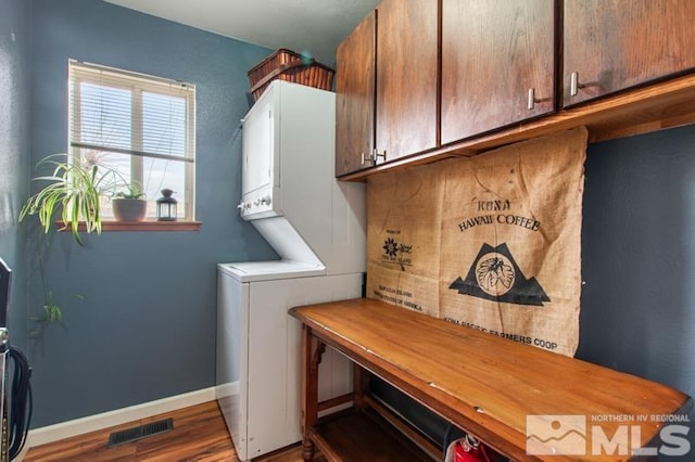 3920 W 7th St, Reno, NV 89503 - laundry room with cabinet space, estacked washer and dryer, wood finished floors, and baseboards