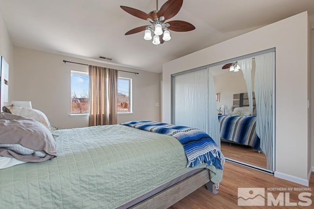 3920 W 7th St, Reno, NV 89503 - bedroom featuring wood finished floors, a closet, ceiling fan, baseboards, and lofted ceiling