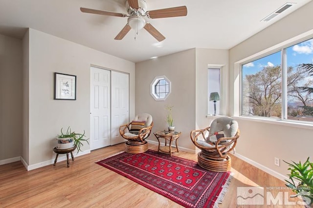 3920 W 7th St, Reno, NV 89503 - living area featuring baseboards, light wood-style flooring, and a ceiling fan