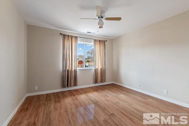 3920 W 7th St, Reno, NV 89503 - empty room featuring wood finished floors, ceiling fan, and baseboards