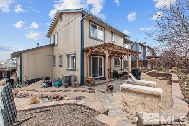 3920 W 7th St, Reno, NV 89503 - back of house with a pergola, a patio area, a fenced backyard, and central AC