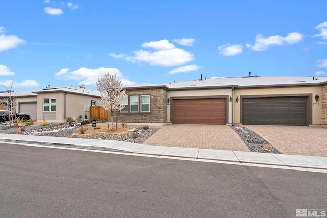7393 Oakmont Ln, Sparks, NV 89441 - ranch-style house featuring a garage, decorative driveway, and stucco siding