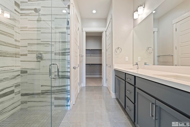 7393 Oakmont Ln, Sparks, NV 89441 - bathroom with a stall shower, recessed lighting, double vanity, and a walk in closet