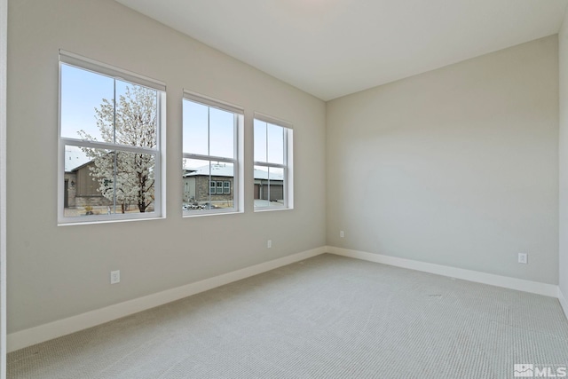 7393 Oakmont Ln, Sparks, NV 89441 - carpeted empty room featuring plenty of natural light and baseboards