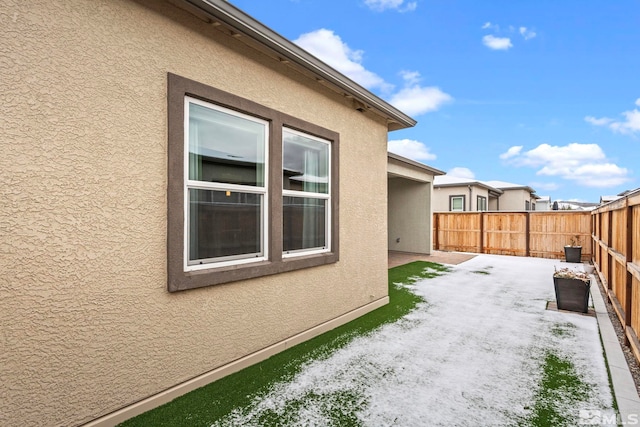 7393 Oakmont Ln, Sparks, NV 89441 - view of side of property featuring a patio, stucco siding, and a fenced backyard