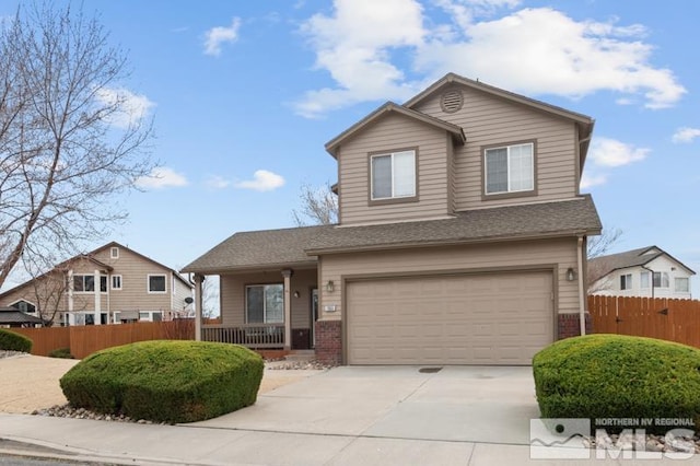 7655 Los Lagos Ave, Sparks, NV 89436 - view of front of home featuring fence, an attached garage, driveway, and brick siding