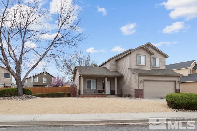 7655 Los Lagos Ave, Sparks, NV 89436 - view of front of property featuring a porch, an attached garage, concrete driveway, and fence