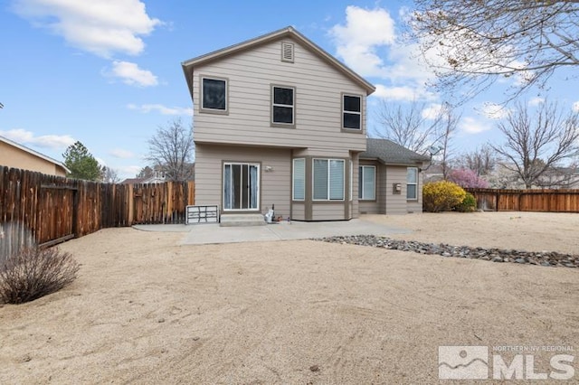 7655 Los Lagos Ave, Sparks, NV 89436 - rear view of property featuring entry steps, a patio, and a fenced backyard