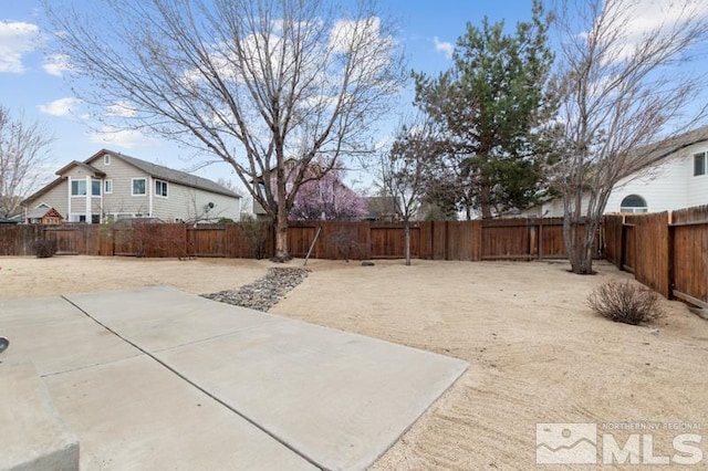 7655 Los Lagos Ave, Sparks, NV 89436 - fenced backyard with a patio area