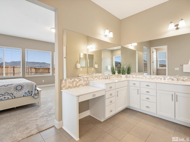 11641 Vista Park Dr, Sparks, NV 89441 - full bath featuring tile patterned flooring, vanity, baseboards, and ensuite bathroom