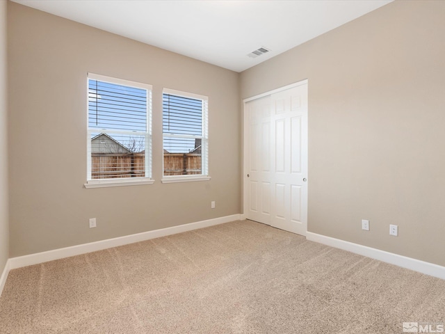 11641 Vista Park Dr, Sparks, NV 89441 - unfurnished bedroom with baseboards, light colored carpet, and a closet