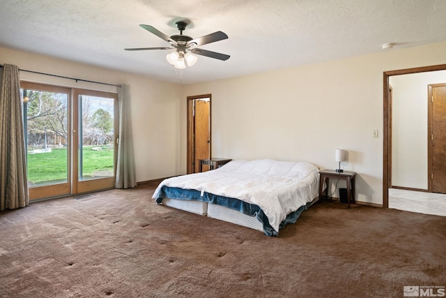 2266 W Washington St, Carson City, NV 89703 - carpeted bedroom featuring access to outside, ceiling fan, and a textured ceiling