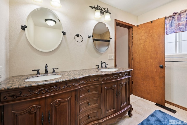 2266 W Washington St, Carson City, NV 89703 - bathroom with double vanity and tile patterned floors