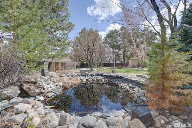 2266 W Washington St, Carson City, NV 89703 - view of yard with fence and a small pond