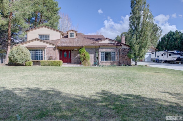 2266 W Washington St, Carson City, NV 89703 - view of front facade featuring a front lawn, brick siding, and a chimney