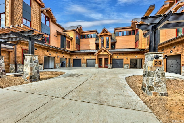 28 Beach Club Dr Unit 408, Stateline, NV 89449 - townhome / multi-family property with stone siding, driveway, and an attached garage