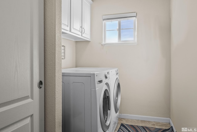 18190 Cody Ct, Reno, NV 89508 - clothes washing area featuring washing machine and clothes dryer, cabinet space, and baseboards