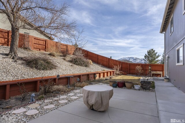 18190 Cody Ct, Reno, NV 89508 - view of patio / terrace featuring a mountain view and a fenced backyard