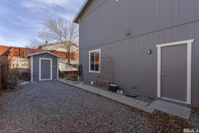 18190 Cody Ct, Reno, NV 89508 - view of side of property with a shed, fence, an outbuilding, and crawl space