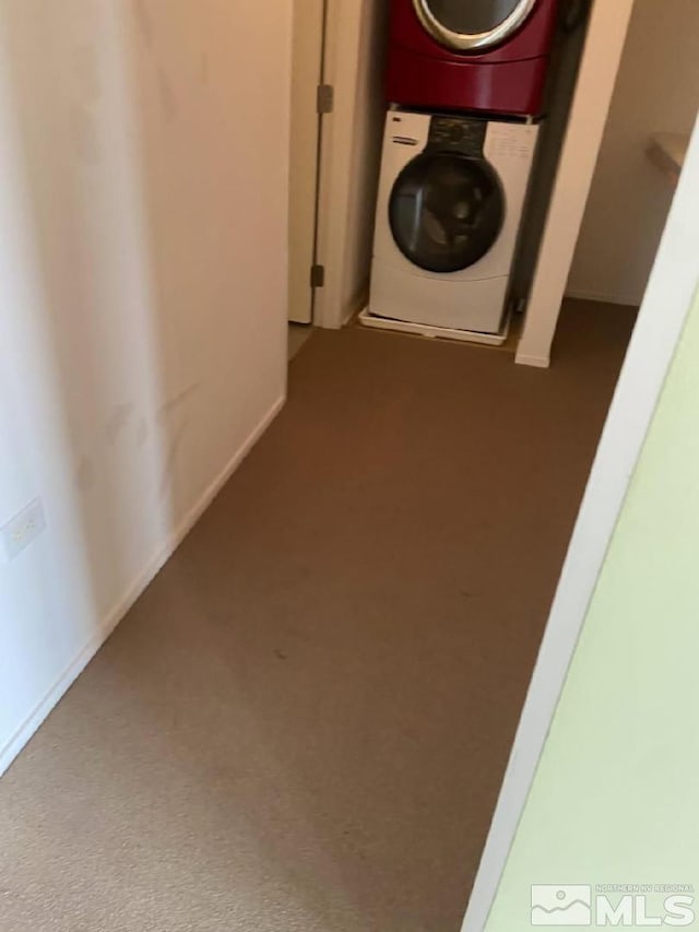 255 N Sierra St Unit 1709, Reno, NV 89501 - laundry area featuring estacked washer and dryer, carpet, and baseboards
