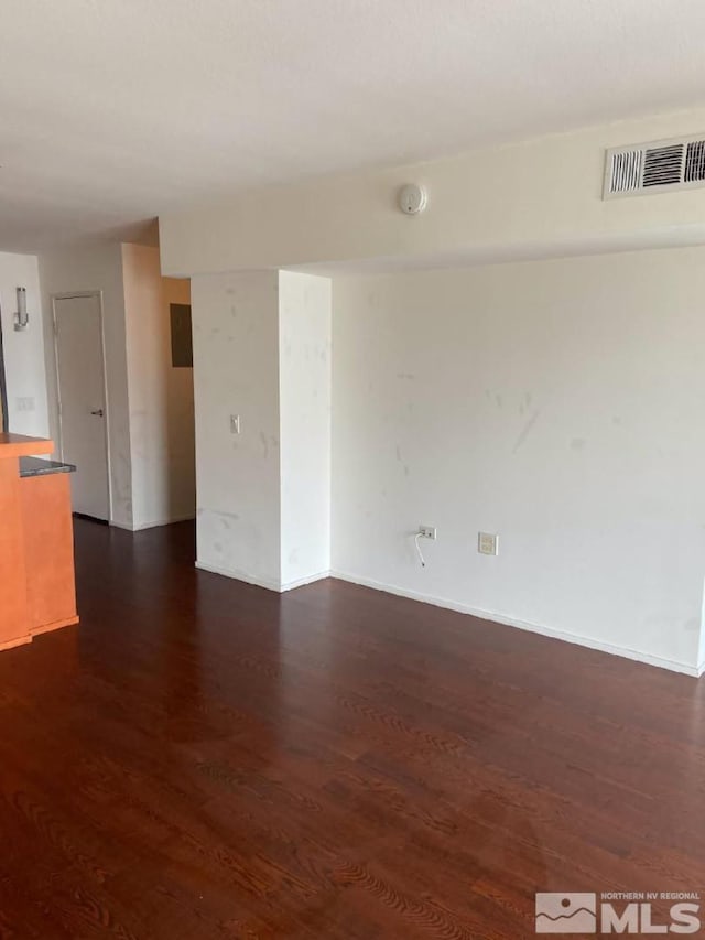255 N Sierra St Unit 1709, Reno, NV 89501 - spare room featuring dark wood-type flooring and baseboards