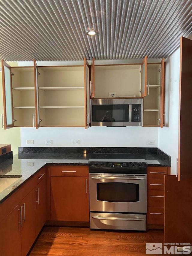 255 N Sierra St Unit 1709, Reno, NV 89501 - kitchen with open shelves, stainless steel appliances, and wood finished floors