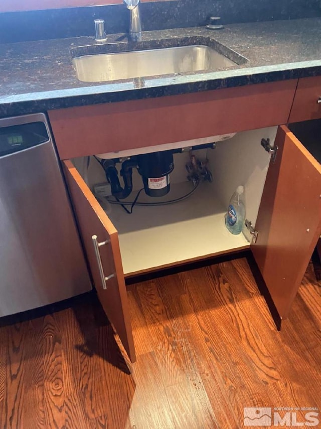255 N Sierra St Unit 1709, Reno, NV 89501 - detailed view of dishwasher, a sink, wood finished floors, and dark countertops