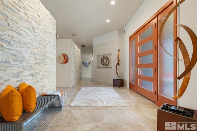 hall featuring recessed lighting