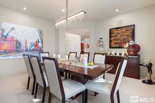 carpeted dining room featuring recessed lighting