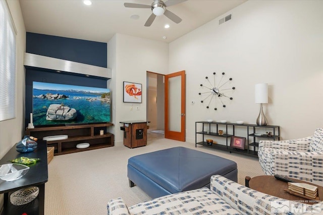 carpeted cinema with a ceiling fan, high vaulted ceiling, and recessed lighting