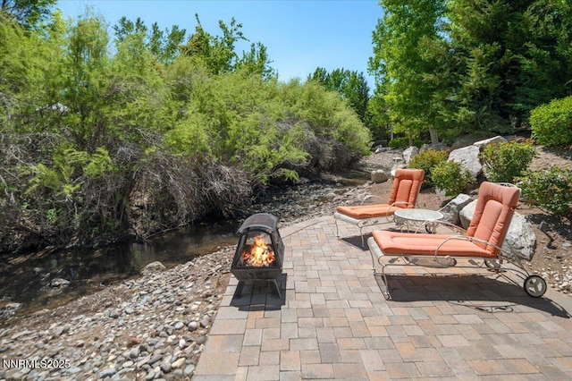 view of patio featuring a fire pit
