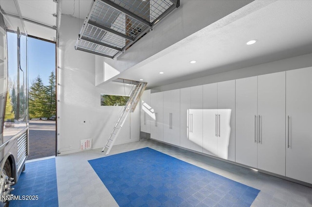garage featuring recessed lighting