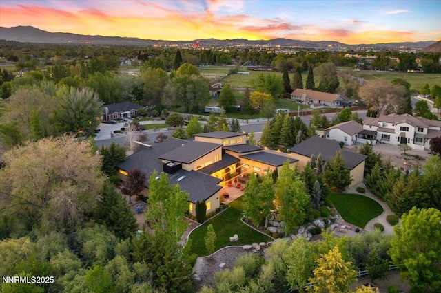 10064 Dixon Ln, Reno, NV 89511 - aerial view at dusk of a mountain view and a residential view