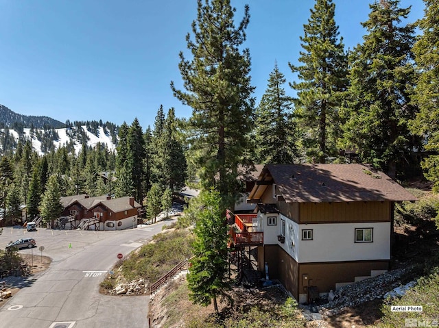 1348 Tirol Dr, Incline Village, NV 89451 - view of subject property with a mountain backdrop and a forest