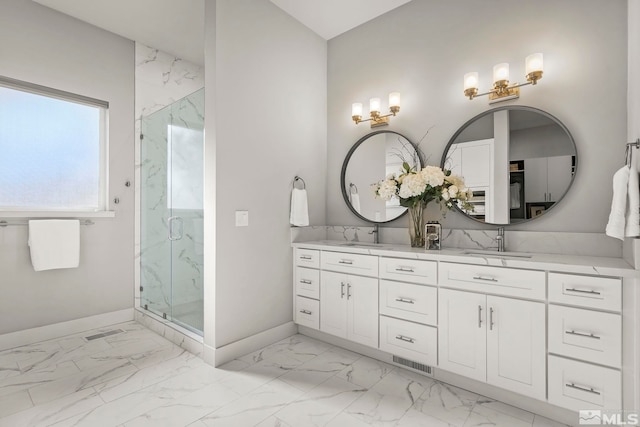 2375 N Harbor Cir, Reno, NV 89519 - bathroom featuring baseboards, marble look tile flooring, a marble finish shower, and double vanity