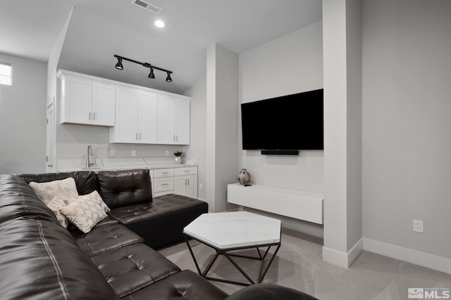 2375 N Harbor Cir, Reno, NV 89519 - living area with light carpet, baseboards, and track lighting