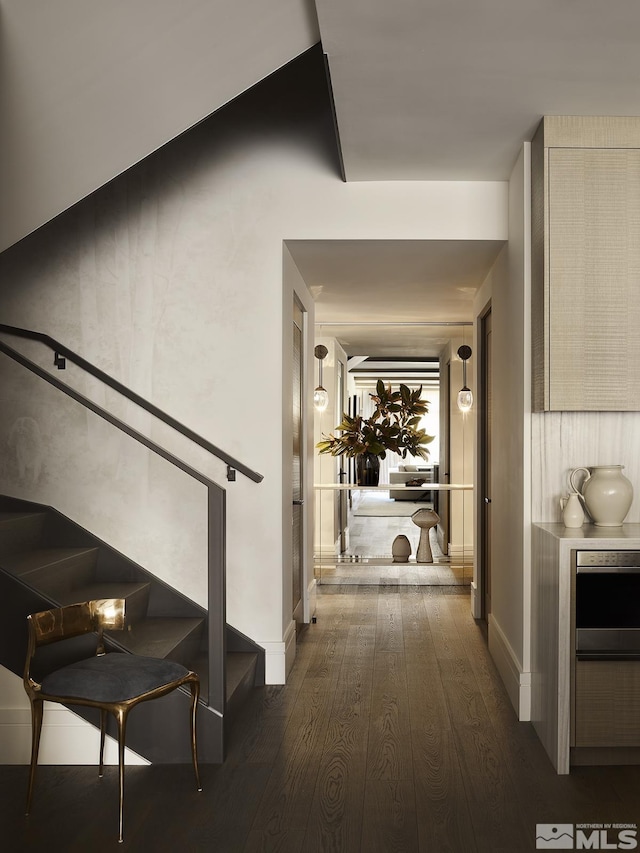 9 Beach Club Dr Unit 116, Stateline, NV 89449 - hallway with dark wood-style floors, stairway, and baseboards