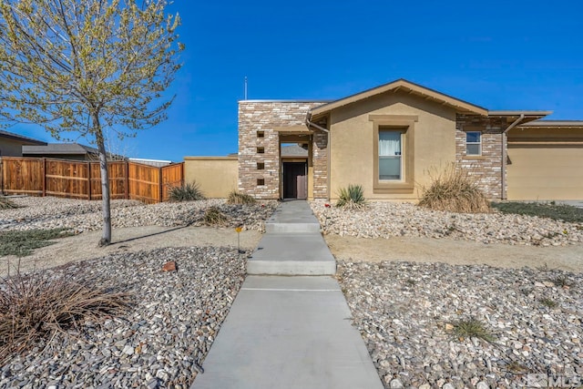 696 Raptor Way, Fernley, NV 89408 - view of front facade featuring fence and stucco siding