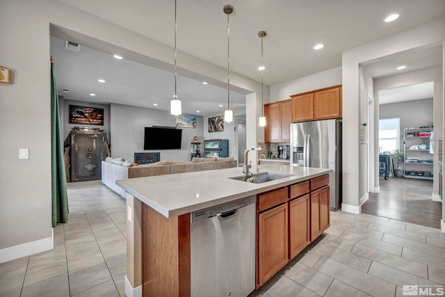 696 Raptor Way, Fernley, NV 89408 - kitchen featuring appliances with stainless steel finishes, a sink, open floor plan, light countertops, and recessed lighting