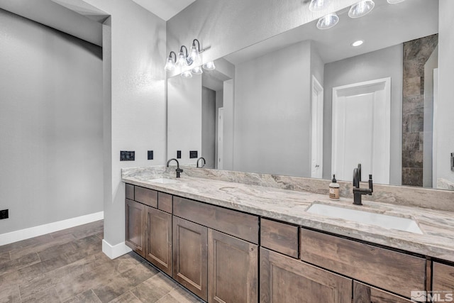 696 Raptor Way, Fernley, NV 89408 - bathroom with baseboards and double vanity