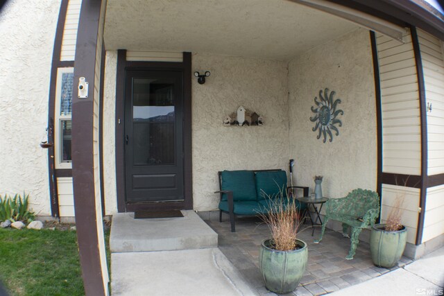 1754 Pinewood Dr Unit 14, Minden, NV 89423 - view of exterior entry featuring stucco siding and a patio