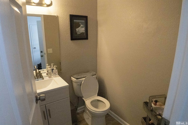 1754 Pinewood Dr Unit 14, Minden, NV 89423 - bathroom with toilet, vanity, and a textured wall