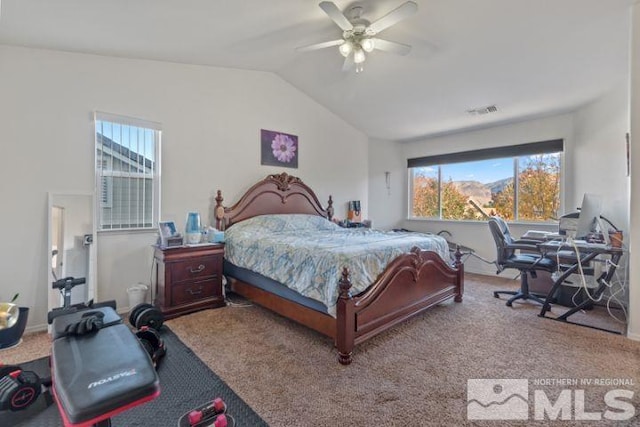 bedroom with multiple windows, vaulted ceiling, carpet floors, and a ceiling fan