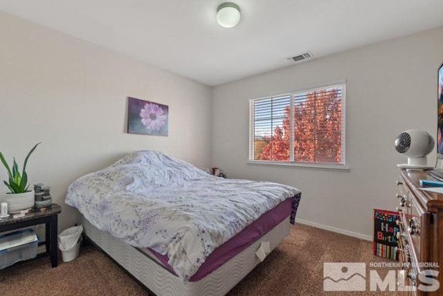 carpeted bedroom with baseboards