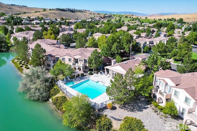6140 Ingleston Dr Unit 525, Sparks, NV 89436 - aerial perspective of suburban area featuring a pool area and a water and mountain view