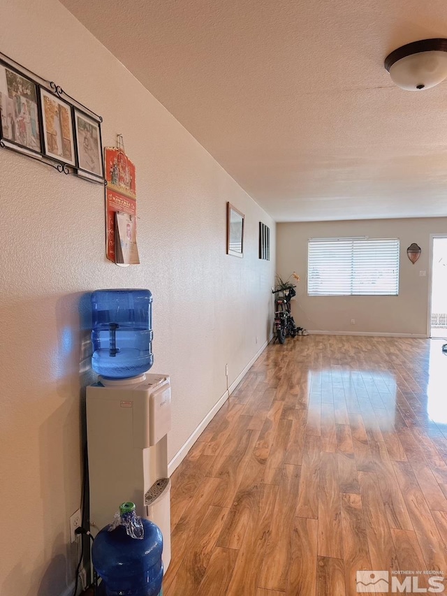 695 York Way, Sparks, NV 89431 - spare room with wood finished floors, a textured ceiling, and baseboards