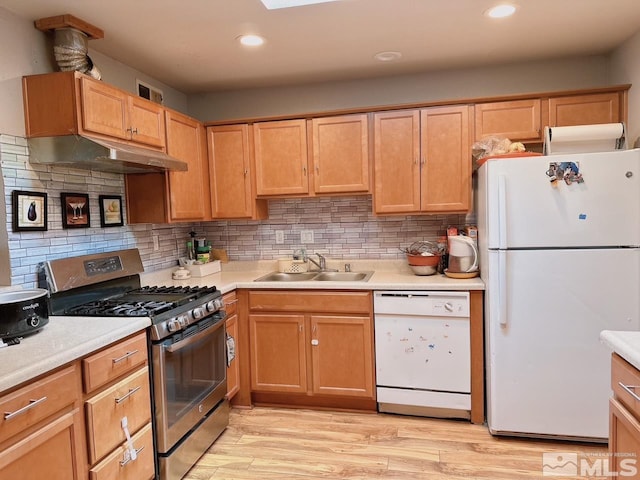 695 York Way, Sparks, NV 89431 - kitchen featuring white appliances, a sink, under cabinet range hood, light countertops, and recessed lighting