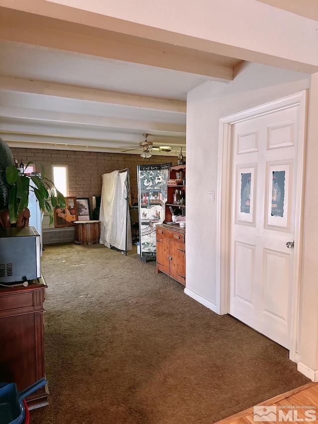 695 York Way, Sparks, NV 89431 - unfurnished bedroom featuring dark carpet and beamed ceiling